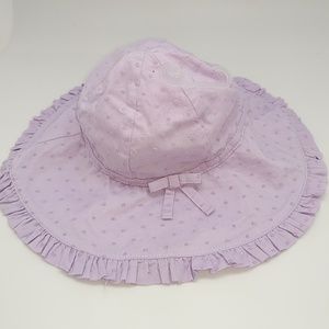 Lilac Infant Girls hat with dots, bow and ruffles.